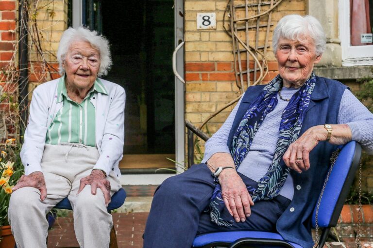 Neighbors share same birthday as they turn 101 and celebrate long, happy lives