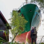Norwegian man awakes to find 443-foot cargo vessel ran aground in his backyard