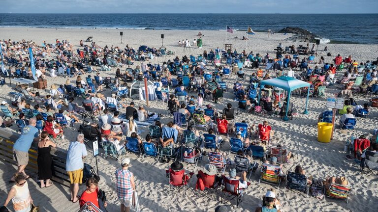 Catholic beach Mass attracts faithful summer worshippers each weekend for sermon and surf