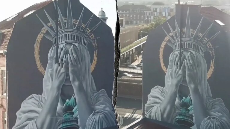 Statue of Liberty mural showing face covered divides social media users on immigration