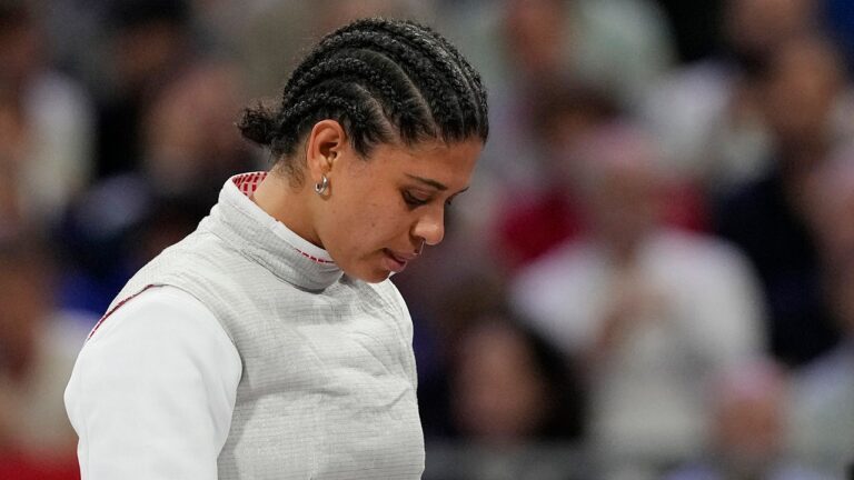 Judges accept French Olympian’s kissing defense, clear her of doping violation